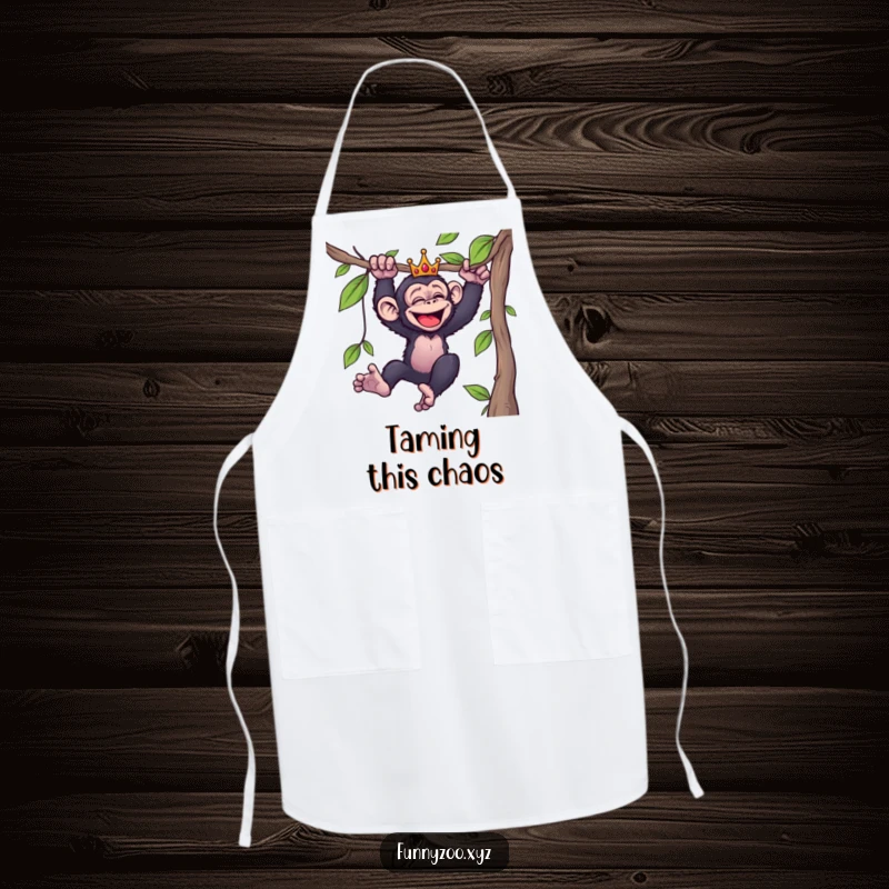 Funny apron showcasing a giggling chimpanzee in a tiny crown, swinging joyfully from a vine, ready to add humor to cooking.