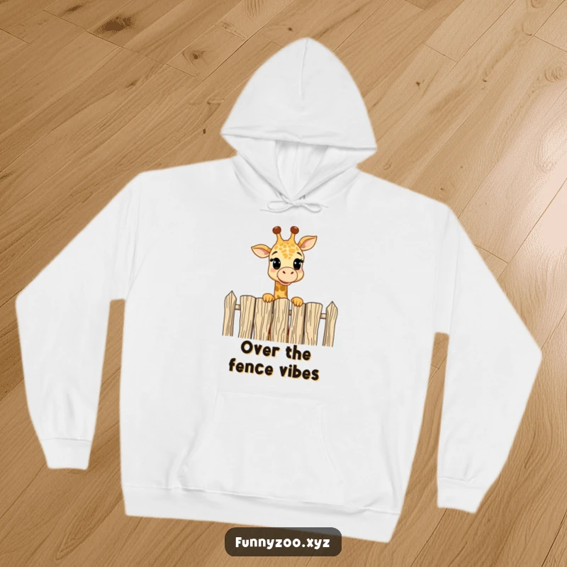 Funny Hoodie: Cute giraffe playfully peering over a tall fence with amusement, a warm and humorous graphic.