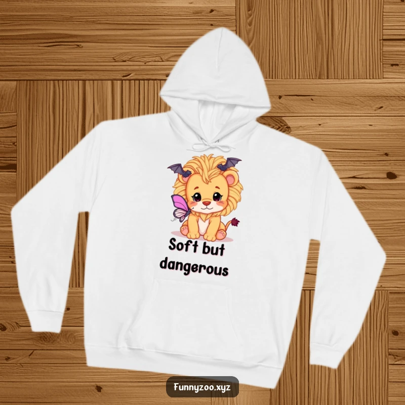 Funny hoodie featuring a playful lion cub with a fluffy yarn mane, enthusiastically batting at a butterfly, designed for comfort.