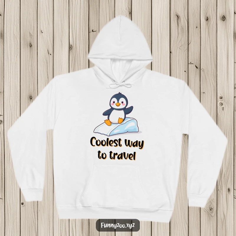 Funny Hoodie: Cute penguin gleefully sliding down a miniature ice slide, a warm and amusing winter graphic.