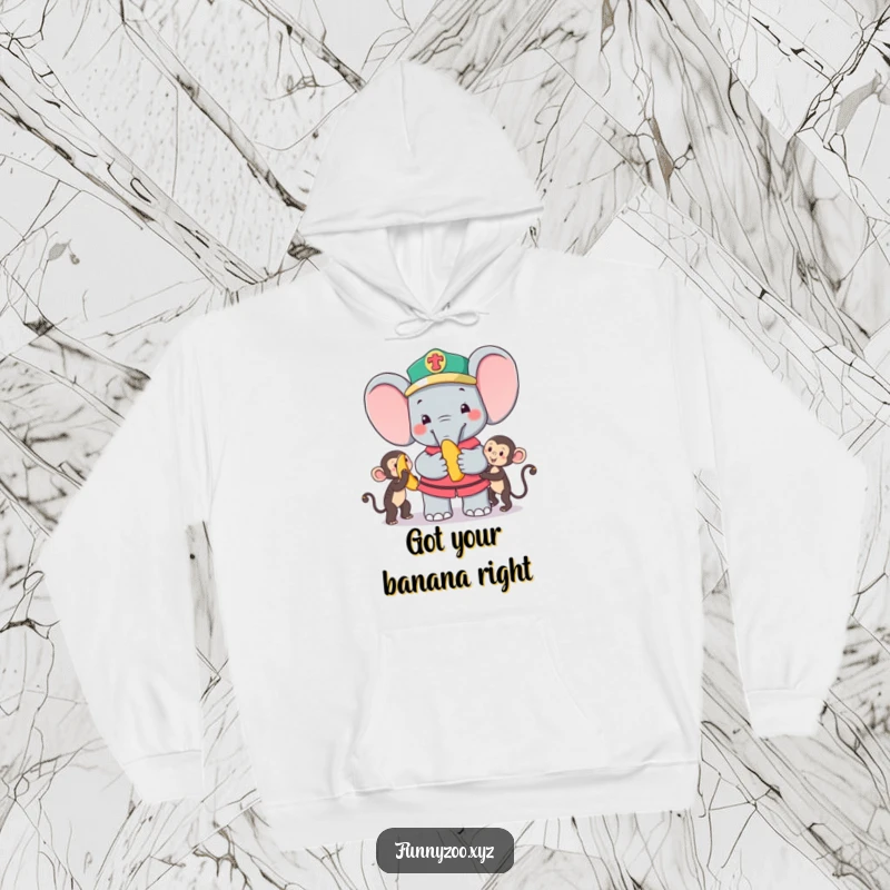 Funny Hoodie: Charming elephant zookeeper happily giving a banana to a playful monkey, a warm and amusing graphic.