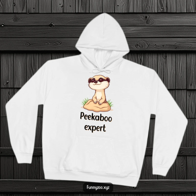 Funny curious meerkat hoodie, depicting a meerkat popping its head out of a burrow, ideal for cozy curiosity.