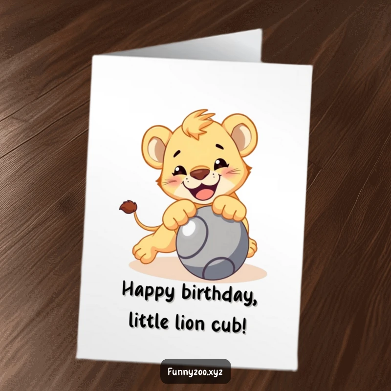 Funny Free Printable birthday card featuring a smiling lion cub playfully pouncing on a rolling ball.