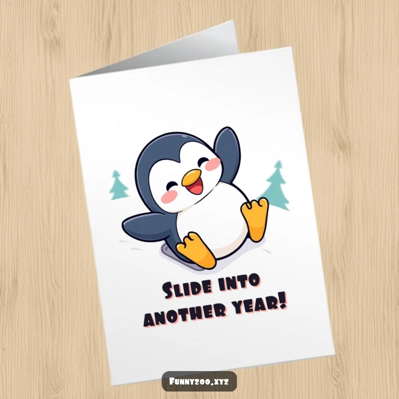 Free Printable Penguin Birthday Card: A penguin slides joyfully down a snowy hill with a big grin, sending birthday wishes.