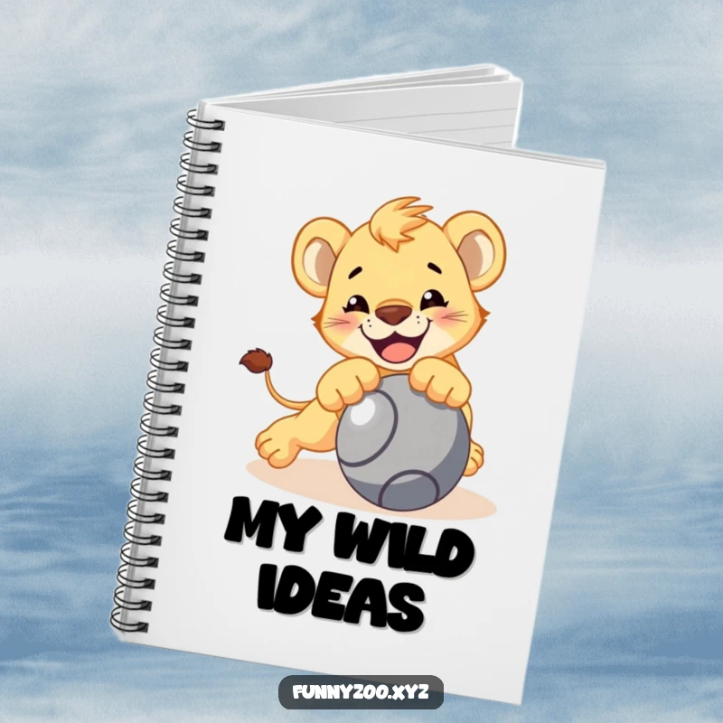 Funny lion cub notebook, character playfully pouncing on a rolling ball, blank pages for notes, bold journal, ideal funny gift.