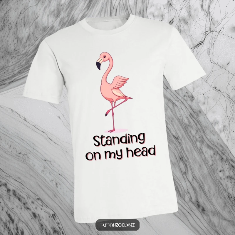 Funny t-shirt print of a flamingo attempting a handstand with wobbly legs, a comical visual gag for bird enthusiasts.