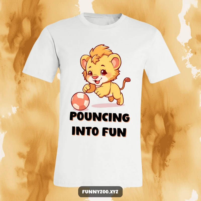 Funny Lion Cub Pounce T-Shirt: Adorable lion cub character humorously pouncing with all its might onto a bouncing ball.