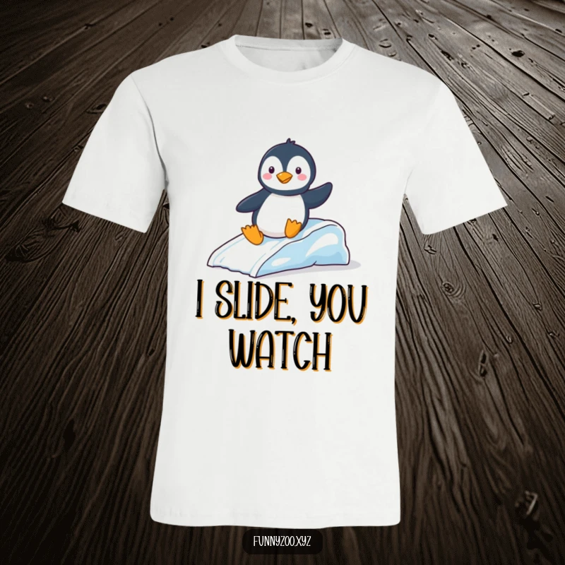 Funny T-Shirt: Amusing penguin expertly sliding down a tiny ice slide, capturing a moment of pure winter delight.