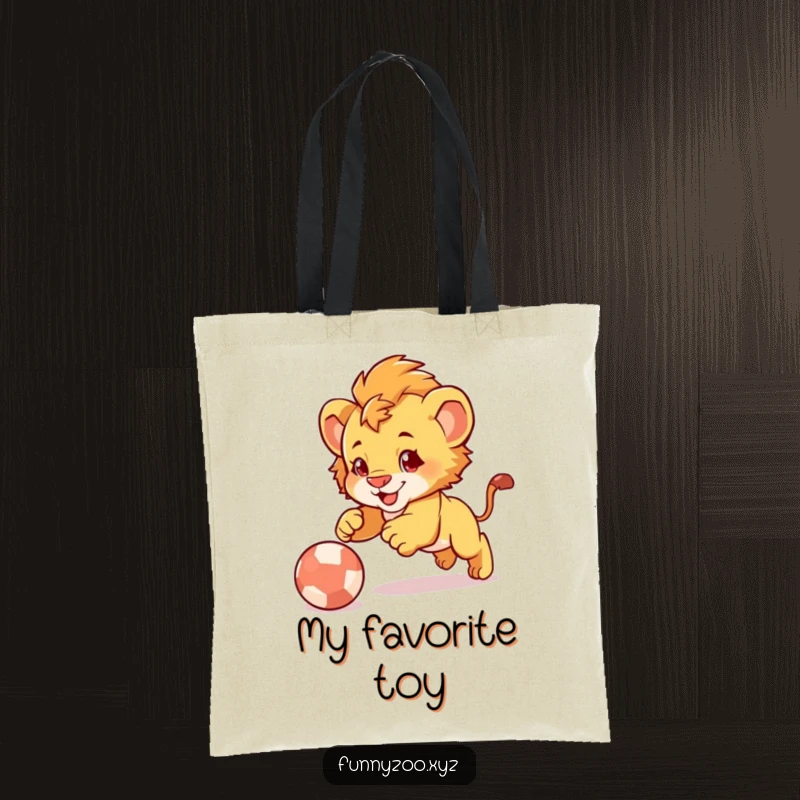 Funny Lion Cub Pounce Tote Bag: Cute lion cub illustration comically pouncing on a bouncing ball, perfect for carrying essentials.