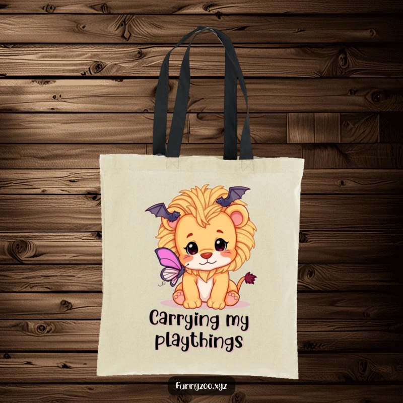 Funny tote bag showcasing a playful lion cub with a mane of fluffy yarn, batting at a delicate butterfly.