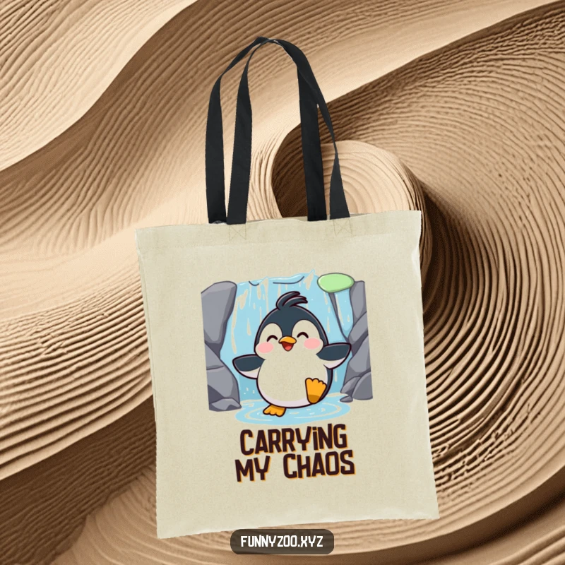 Funny Penguin Waterfall Slide Tote Bag: A tote bag featuring a surprised penguin sliding down a waterfall, perfect for carrying essentials stylishly.